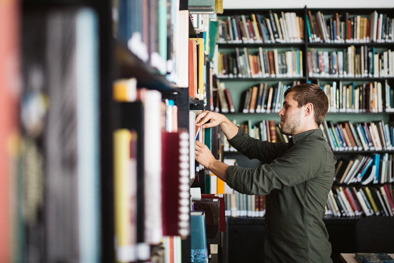 Looking at books on the shelves