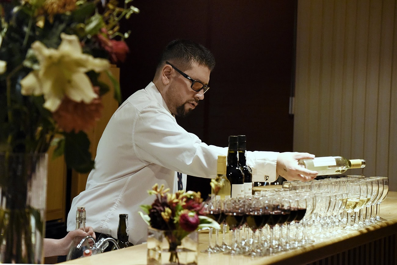 Waiting staff pouring drinks