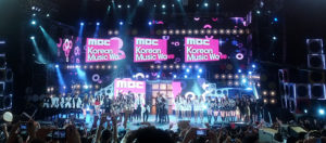 Bands on stage at a K-pop concert