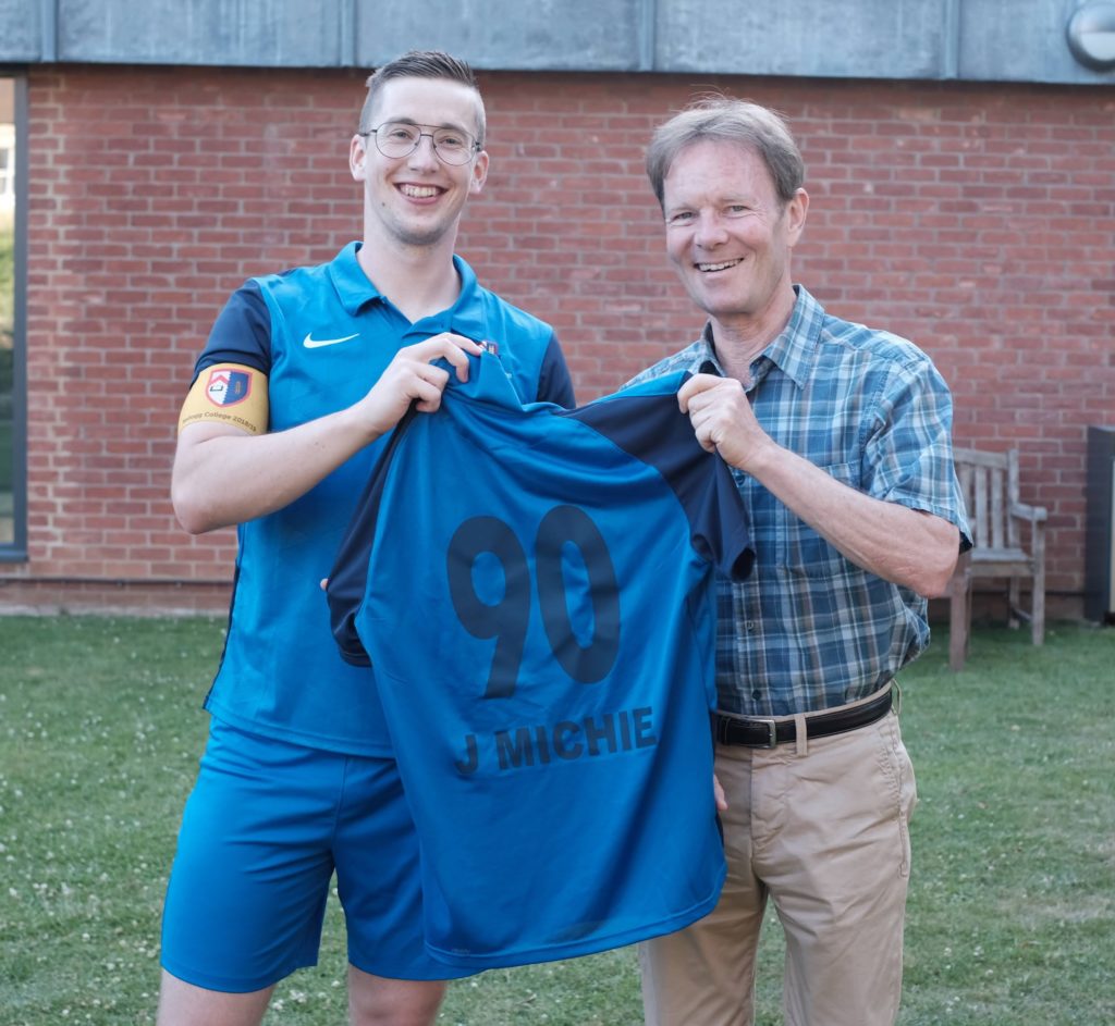 Jonas schone and President Michie with jersey