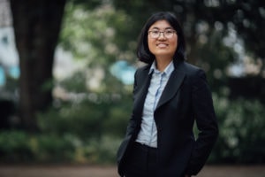 Winning writer Yaning Wu stood in front of trees outside Kellogg