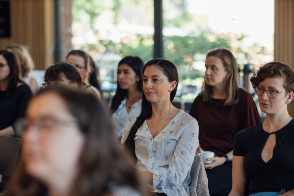 Members of the audience watching the lecture