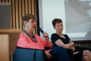 Dorothy Bishop seated on the stage with Susan Michie answering audience questions