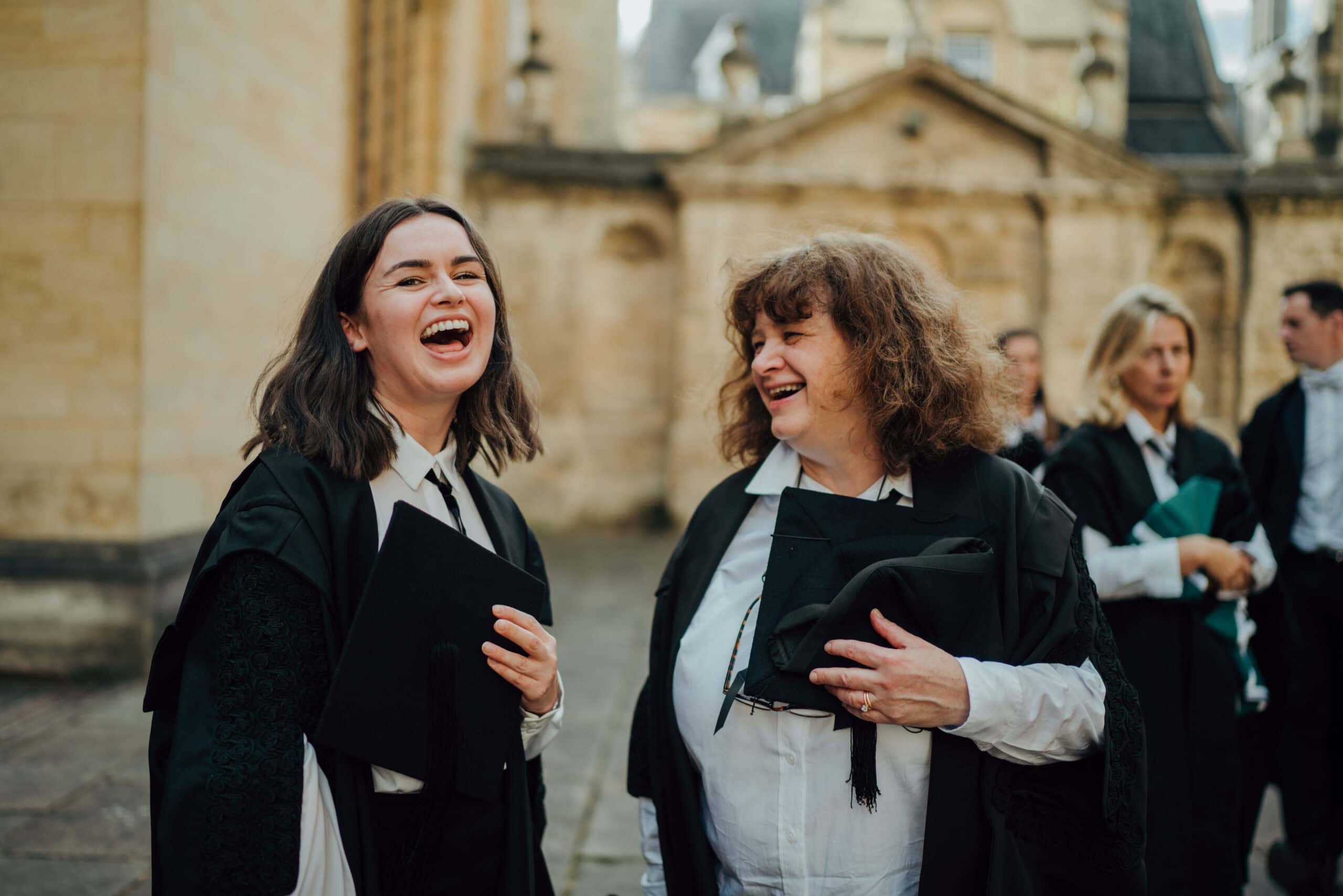 laughing graduates at Sheldonian