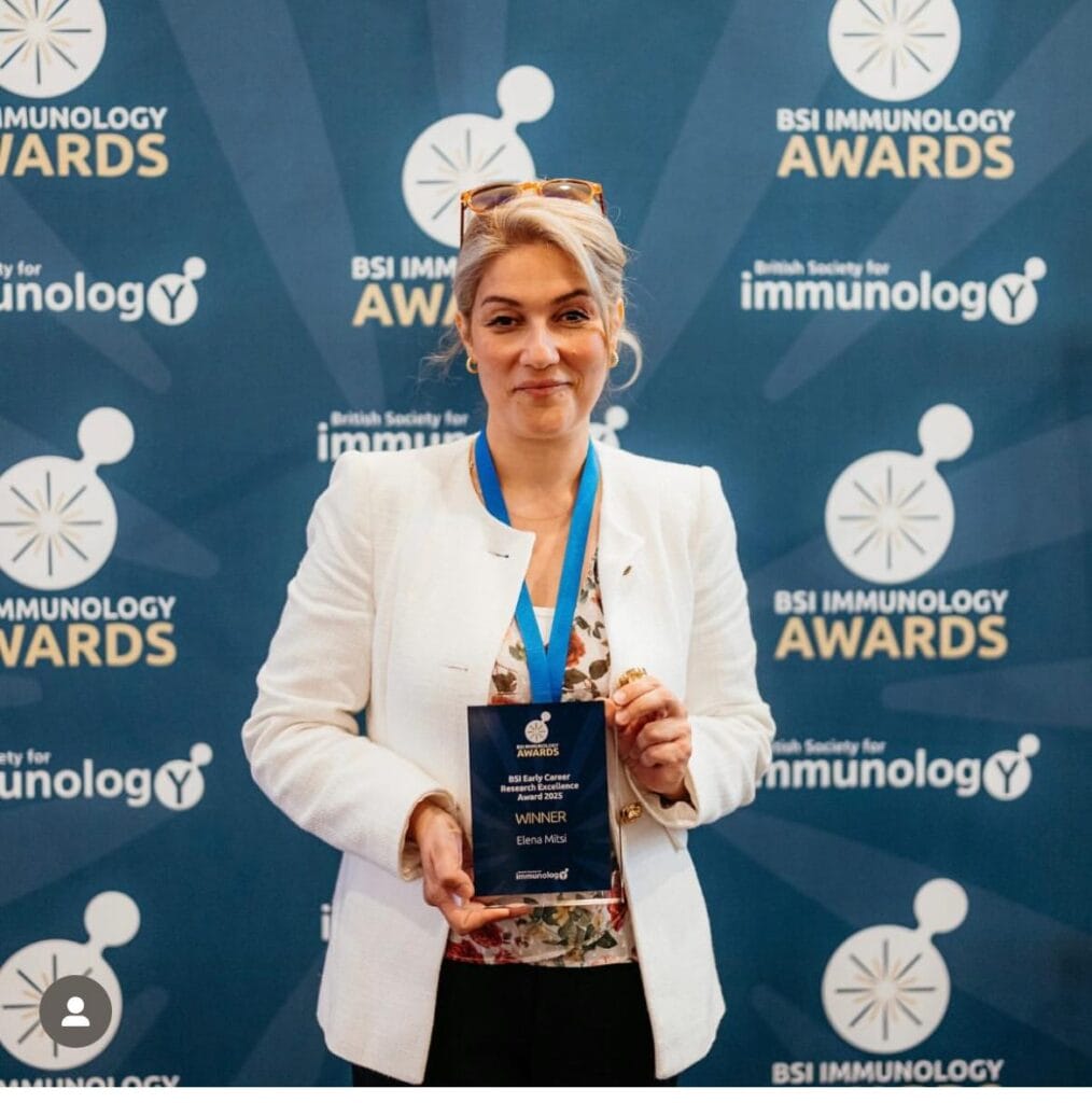Elena Mitsi holding her award.