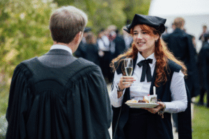 Kellogg student talking to College President Jonathan Michie