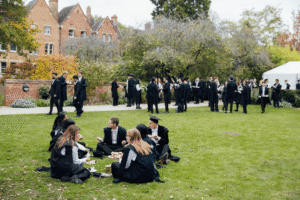 Students sat on College gardens
