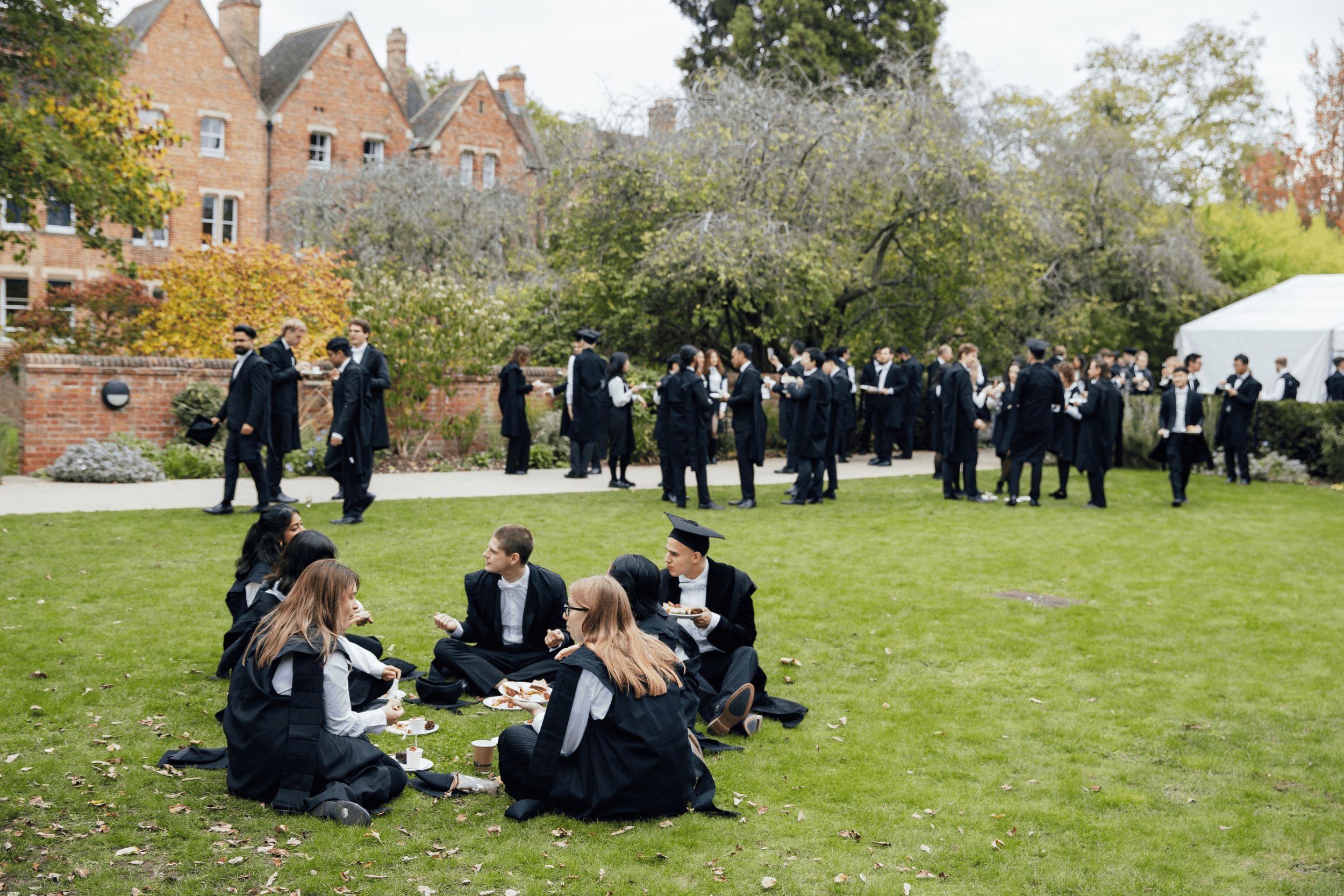 Students sat on College gardens
