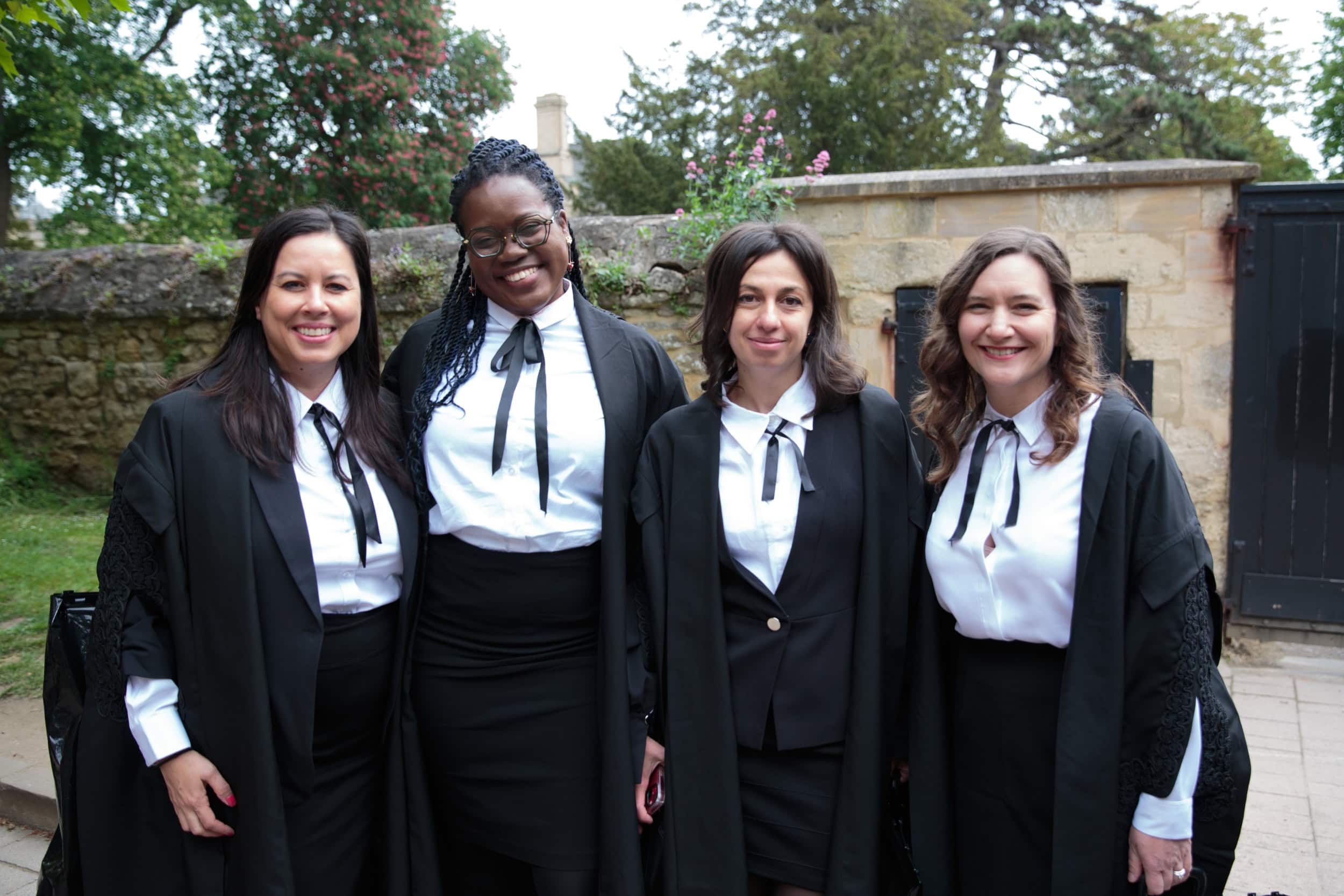 Four female students smiling