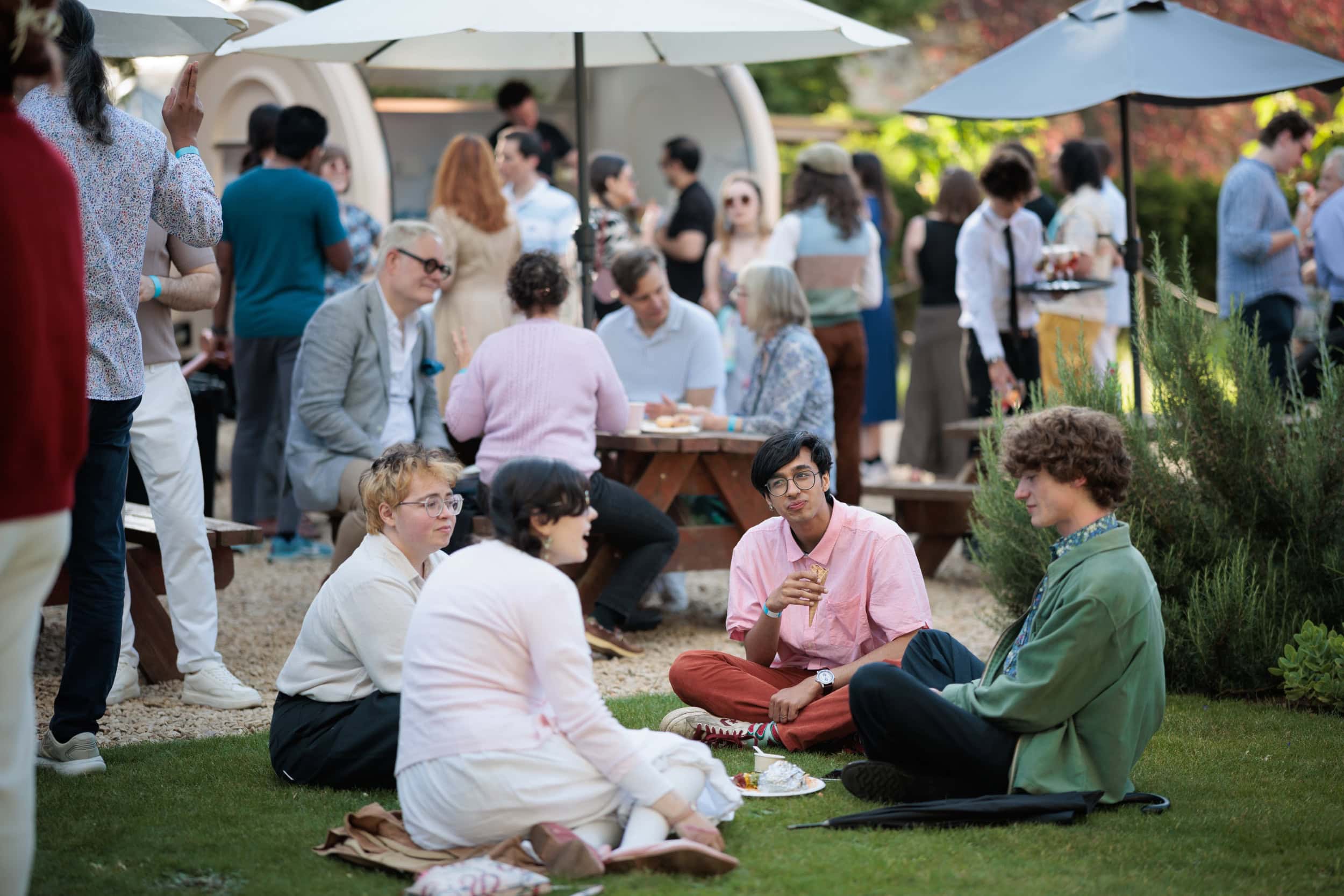 Guests enjoying the Summer Garden Party in the College gardens.