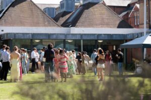 Guests relaxing on the lawn during the Summer Garden Party.