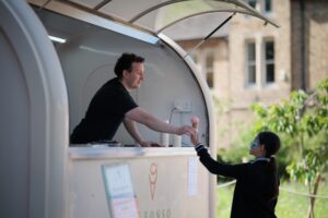 Guest being handed an ice cream