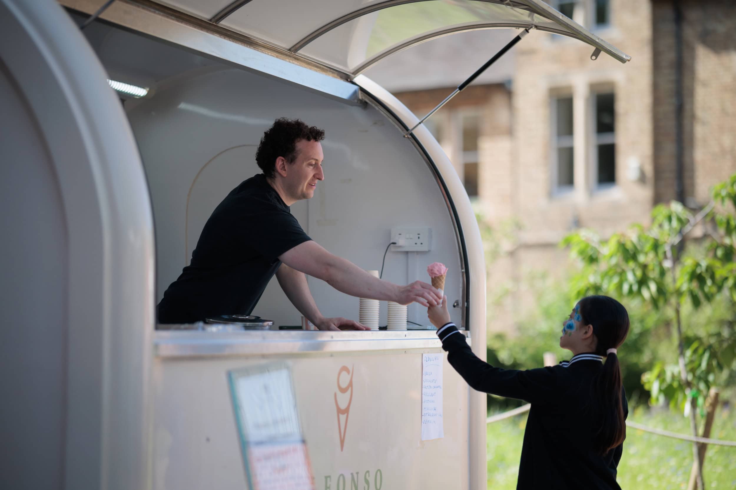 Guest being handed an ice cream